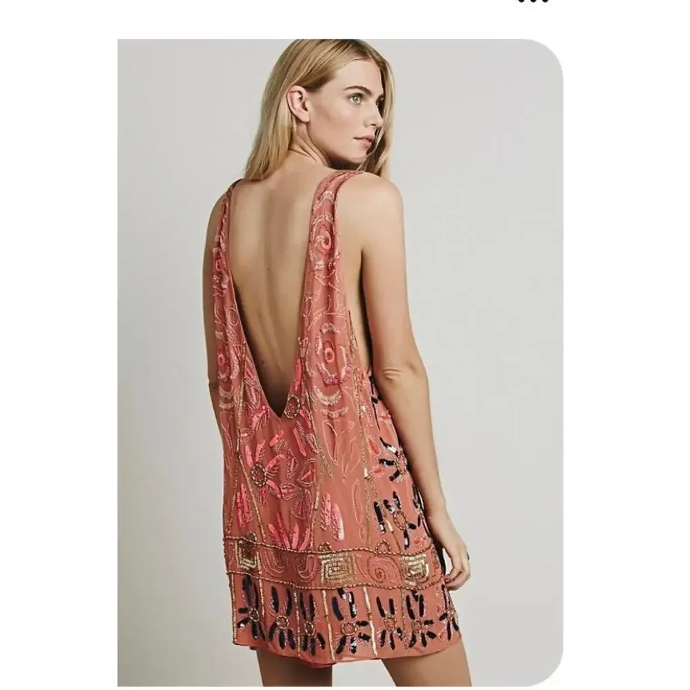 Free People coral tunic dress features intricate gold and blue sequin Size small